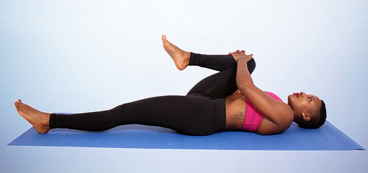 10 Best Exercises for A Stiff Upper Back 3 knee to chest stretch
