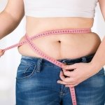 Woman noticing weight changes after quitting alcohol | Weight gain after quitting alcohol