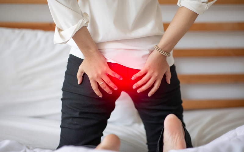 person experiencing hemorrhoids discomfort while sitting | he can try the best hemorrhoids supplements