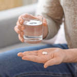 Trazodone tablets on a table with warning label concept | trazodone side effects