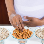 pregnant woman eating almonds safely | side effects of almonds during pregnancy