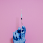 Person receiving glutathione injection for skin lightening treatment | glutathione injection side effects