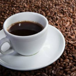 A cup of fat burning enzyme coffee showing ingredients like cellulase and amylase for a healthy lifestyle.
