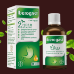 A bottle of natural digestive support drops next to a glass of water showing functional dyspepsia treatment options.